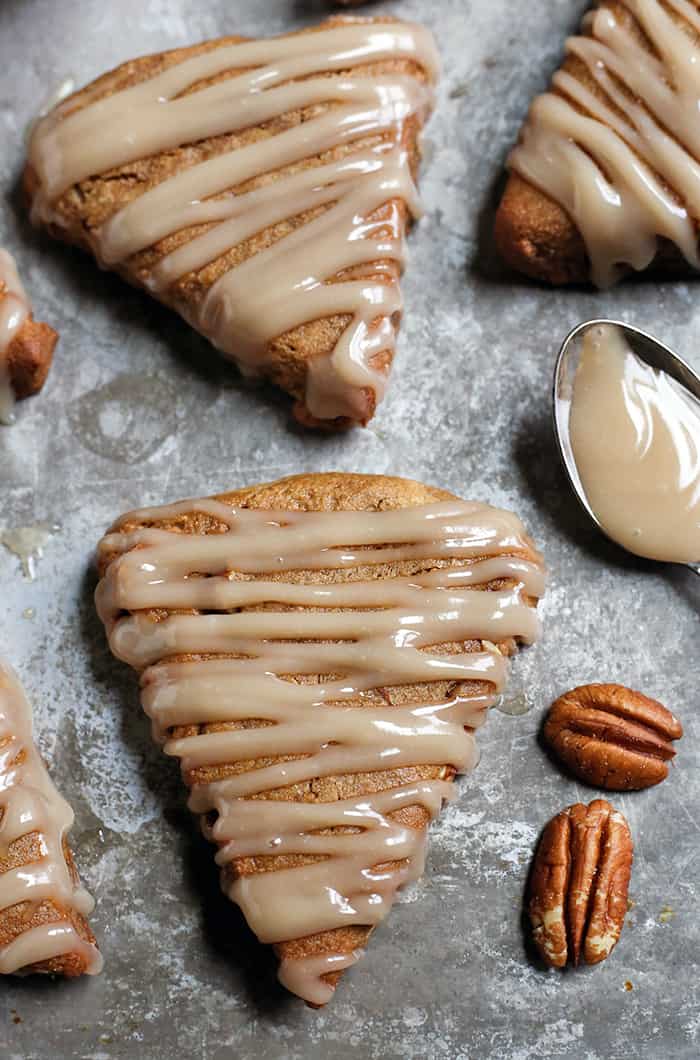 These Paleo Pecan Pie Scones are a fun treat that are easy to make and so delicious! Tender, not overly sweet, and pairs great with a cup of coffee. They are gluten free, dairy free, and naturally sweetened.