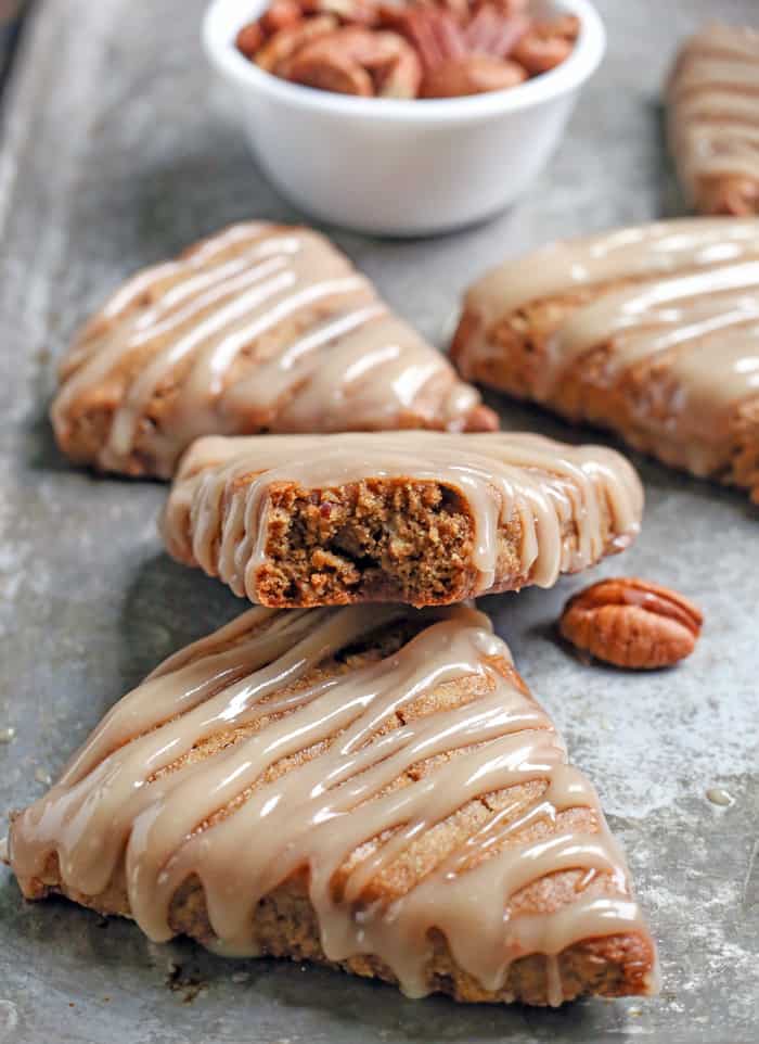 These Paleo Pecan Pie Scones are a fun treat that are easy to make and so delicious! Tender, not overly sweet, and pairs great with a cup of coffee. They are gluten free, dairy free, and naturally sweetened.