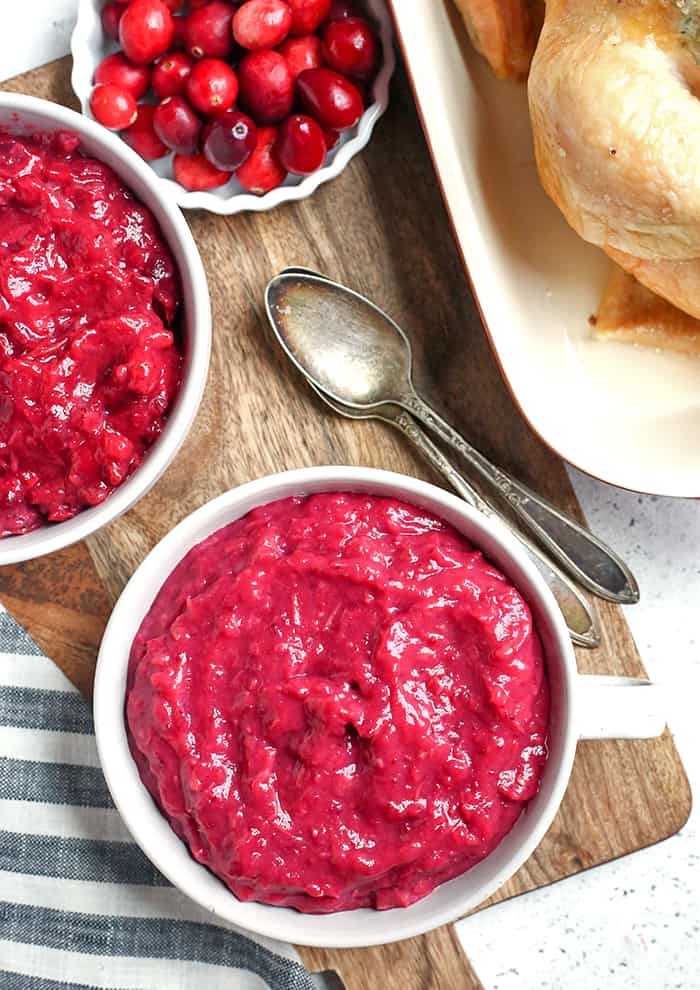 This Paleo Whole30 Easy Cranberry Sauce comes together quickly and is so tasty. Made with just 3 ingredients and sweetened only with fruit. This is a must for your Thanksgiving table!