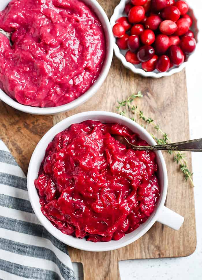 This Paleo Whole30 Easy Cranberry Sauce comes together quickly and is so tasty. Made with just 3 ingredients and sweetened only with fruit. This is a must for your Thanksgiving table!
