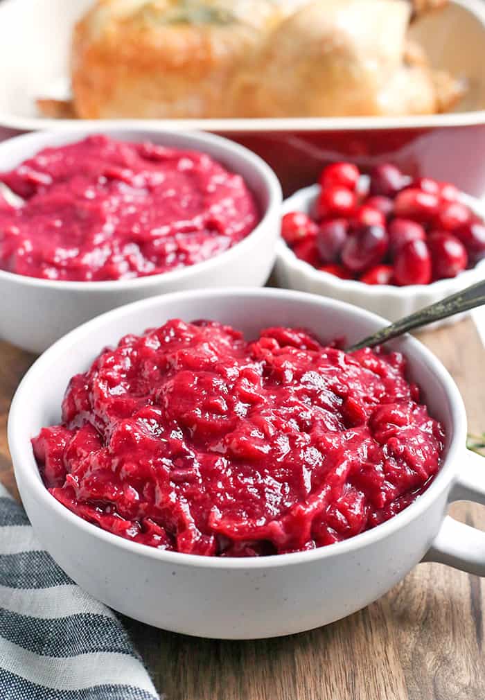 This Paleo Whole30 Easy Cranberry Sauce comes together quickly and is so tasty. Made with just 3 ingredients and sweetened only with fruit. This is a must for your Thanksgiving table!