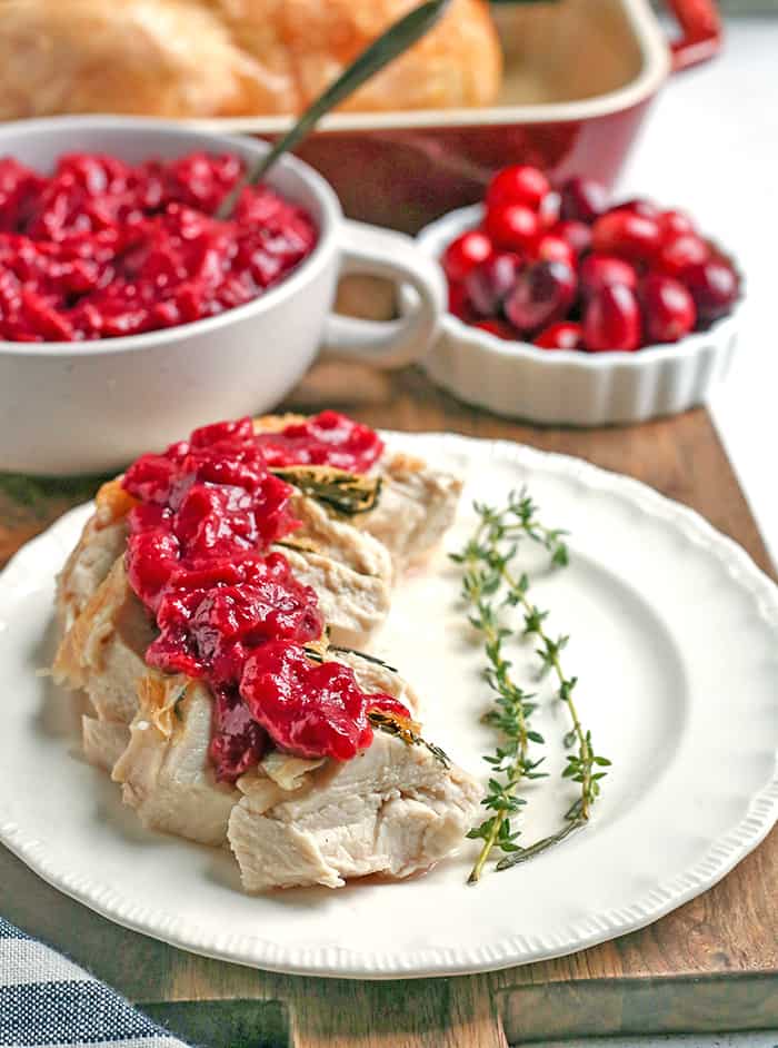 This Paleo Whole30 Easy Cranberry Sauce comes together quickly and is so tasty. Made with just 3 ingredients and sweetened only with fruit. This is a must for your Thanksgiving table!