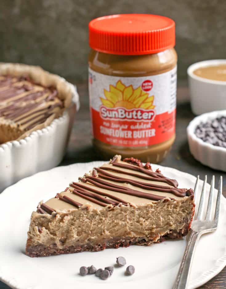 This Nut-Free Paleo Vegan Snickers Pie is an easy no-bake dessert and incredibly delicious! A chewy chocolate crust, creamy caramel layer and soft SunButter mousse. It's gluten free, dairy free, and naturally sweetened.