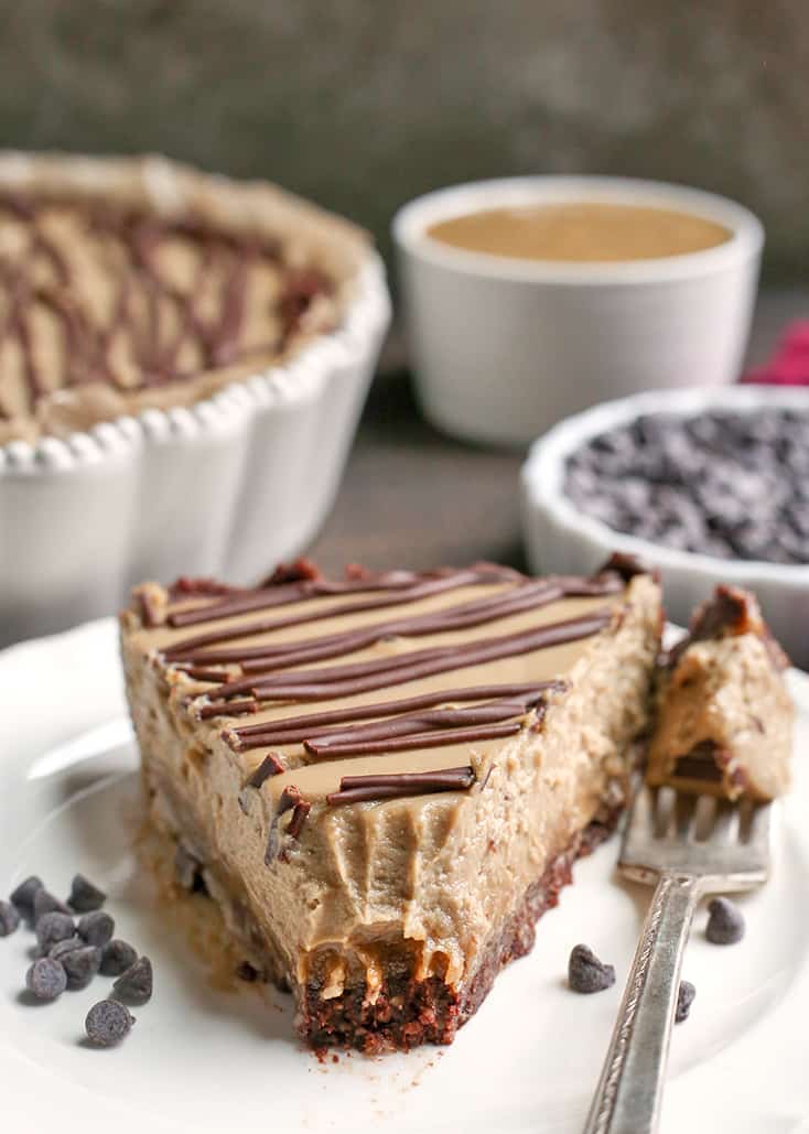 This Nut-Free Paleo Vegan Snickers Pie is an easy no-bake dessert and incredibly delicious! A chewy chocolate crust, creamy caramel layer and soft SunButter mousse. It's gluten free, dairy free, and naturally sweetened.