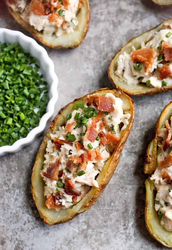 These Paleo Chicken Bacon Ranch Potato Skins make a great meal or appetizer. Juicy chicken, creamy ranch, and crispy bacon packed in a potato skin. They are Whole30, gluten free, dairy free, and low FODMAP.
