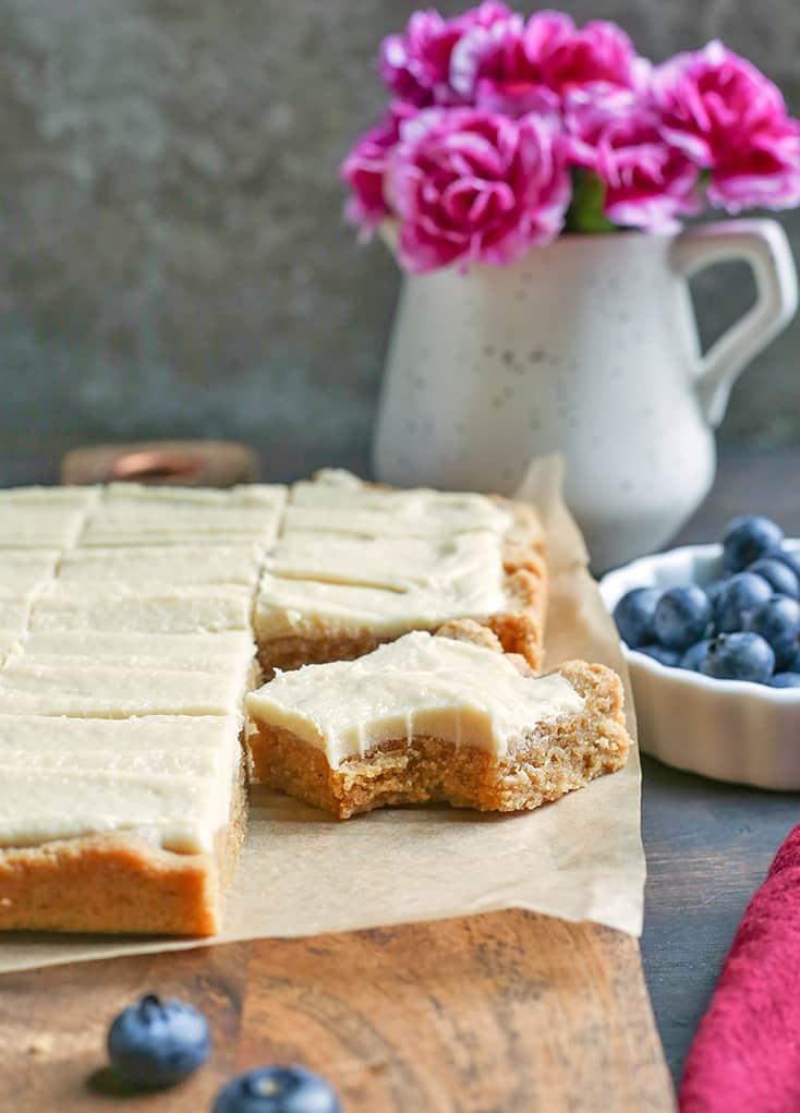 These Paleo Sugar Cookie Bars are so easy to make and have all the same flavors as a sugar cookie. Gluten free, dairy free and naturally sweetened.