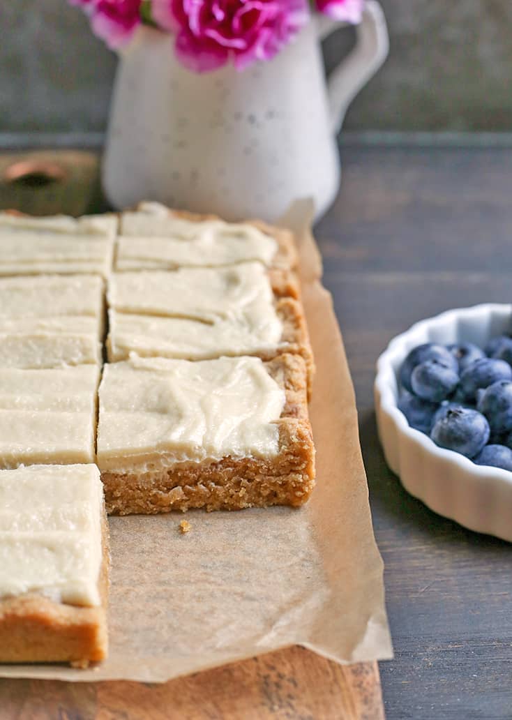 These Paleo Sugar Cookie Bars are so easy to make and have all the same flavors as a sugar cookie. Gluten free, dairy free and naturally sweetened.