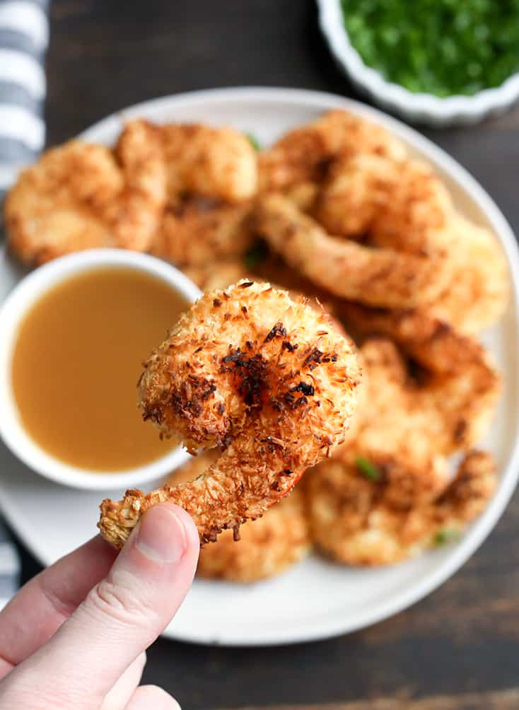 This Paleo Whole30 Air Fryer Coconut Shrimp is quick, easy, and delicious! Golden brown, crispy, and a great dinner or appetizer. They're gluten free, dairy free, and dipped in a naturally sweetened sauce.