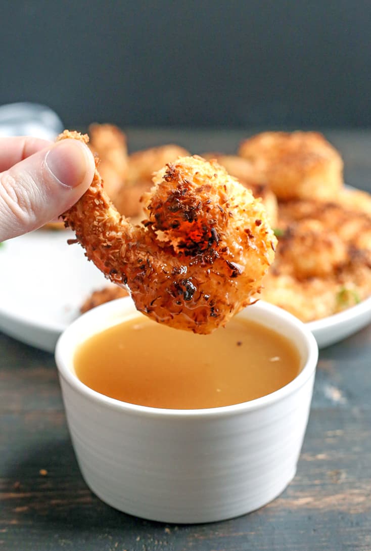 This Paleo Whole30 Air Fryer Coconut Shrimp is quick, easy, and delicious! Golden brown, crispy, and a great dinner or appetizer. They're gluten free, dairy free, and dipped in a naturally sweetened sauce.