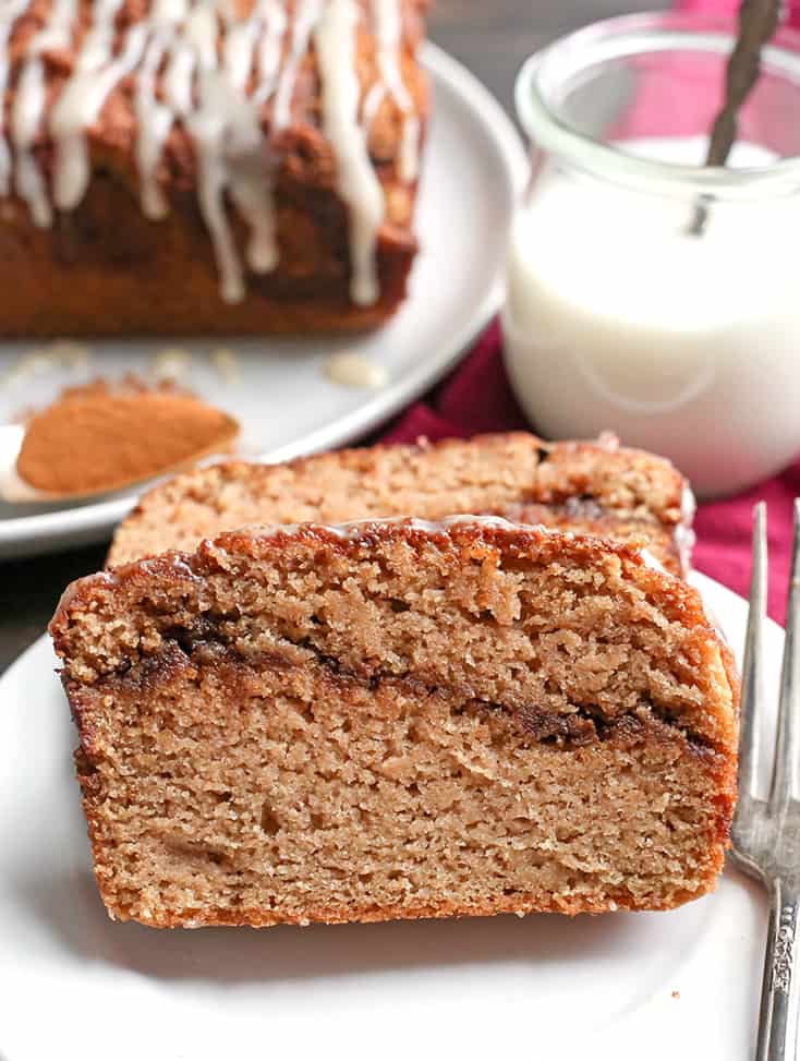 This Paleo Cinnamon Roll Quick Bread is so easy to make and tastes incredible! Tender cake with a sweet cinnamon swirl and drizzled with a thick glaze. Gluten free, dairy free, and naturally sweetened.