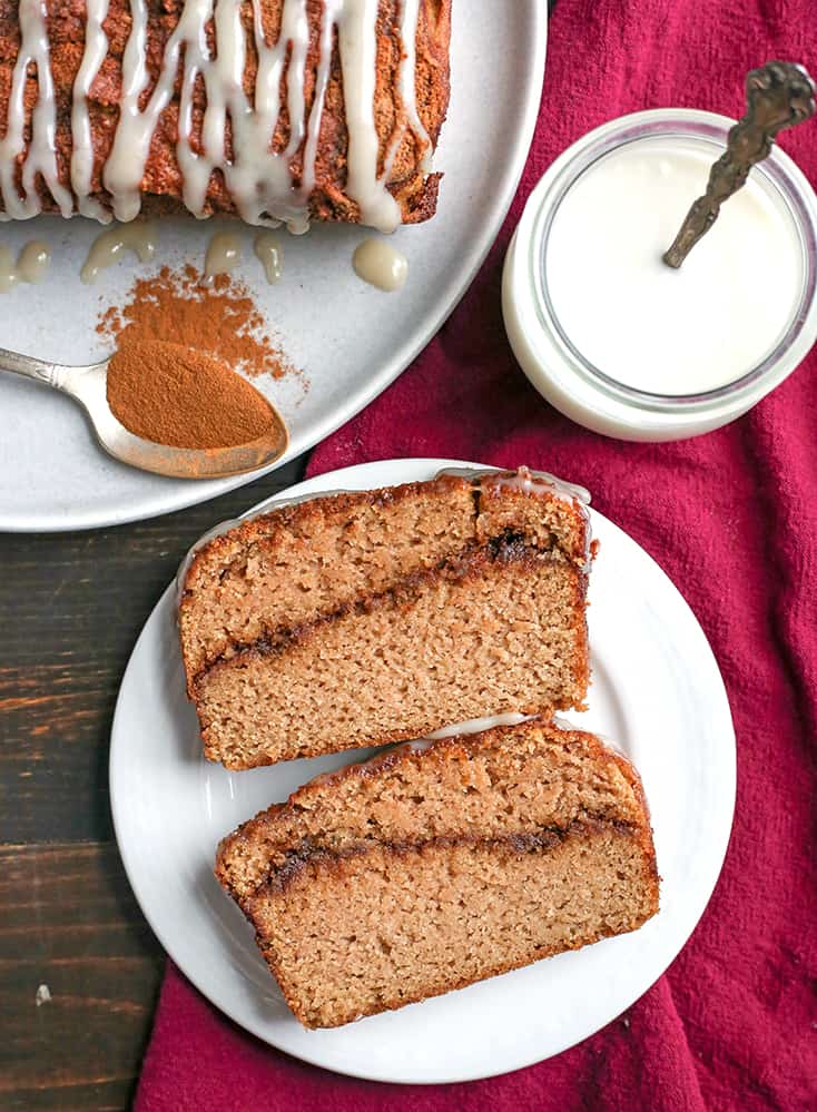 This Paleo Cinnamon Roll Quick Bread is so easy to make and tastes incredible! Tender cake with a sweet cinnamon swirl and drizzled with a thick glaze. Gluten free, dairy free, and naturally sweetened.