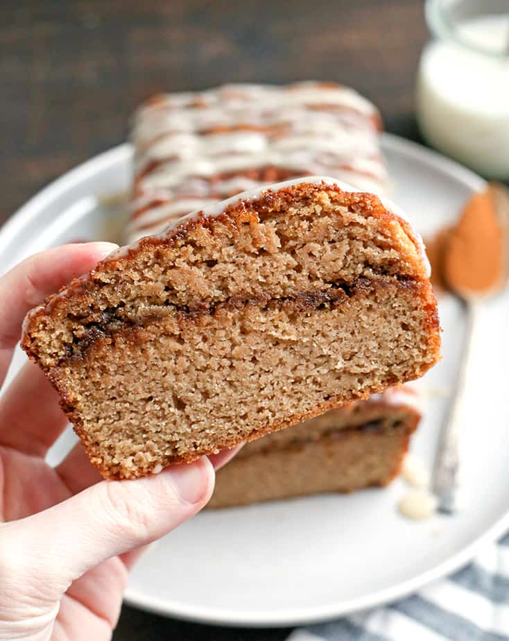 This Paleo Cinnamon Roll Quick Bread is so easy to make and tastes incredible! Tender cake with a sweet cinnamon swirl and drizzled with a thick glaze. Gluten free, dairy free, and naturally sweetened.