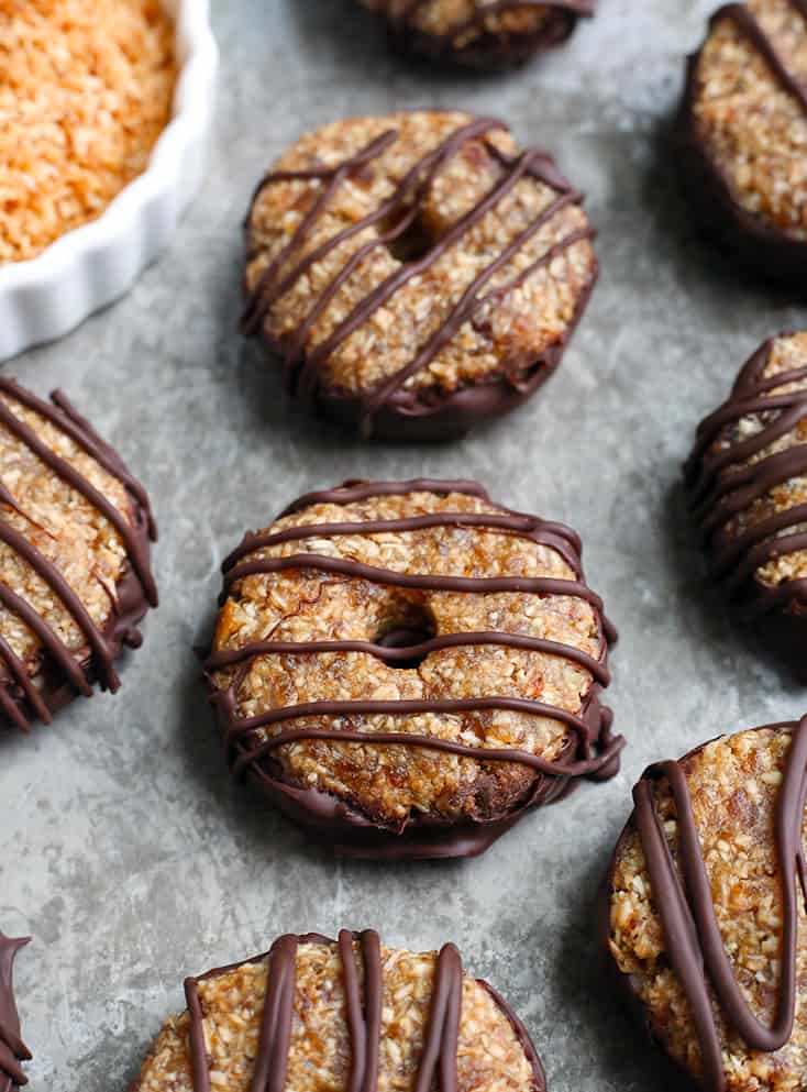 These Paleo Vegan Samoa Cookies are easy, no-bake, and so delicious! A shortbread cookie topped with toasted coconut and caramel. Gluten free, dairy free, nut free, egg free and naturally sweetened.