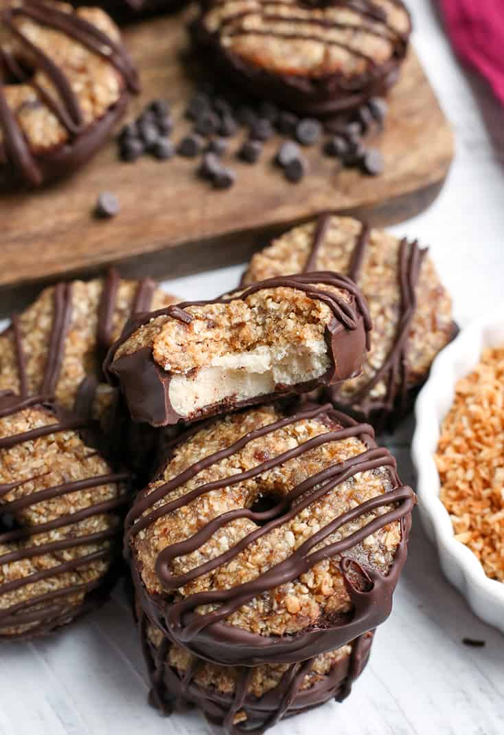 These Paleo Vegan Samoa Cookies are easy, no-bake, and so delicious! A shortbread cookie topped with toasted coconut and caramel. Gluten free, dairy free, nut free, egg free and naturally sweetened.