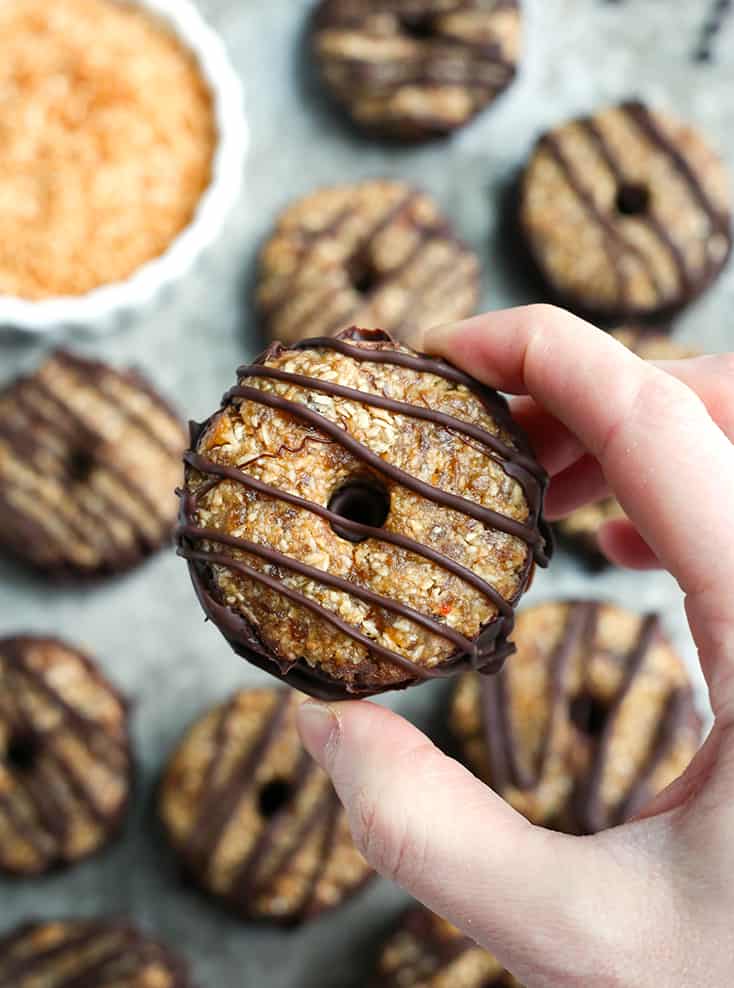 These Paleo Vegan Samoa Cookies are easy, no-bake, and so delicious! A shortbread cookie topped with toasted coconut and caramel. Gluten free, dairy free, nut free, egg free and naturally sweetened.