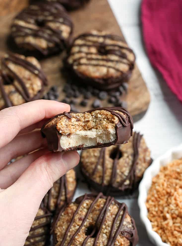 These Paleo Vegan Samoa Cookies are easy, no-bake, and so delicious! A shortbread cookie topped with toasted coconut and caramel. Gluten free, dairy free, nut free, egg free and naturally sweetened.