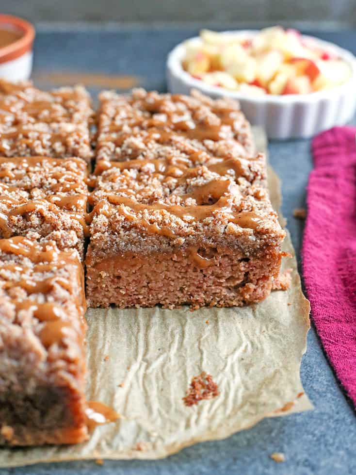 This Paleo Caramel Apple Coffee Cake is tender, moist, with the best crumb topping and a sweet drizzle of caramel. It's gluten free, dairy free, naturally sweetened and so delicious!
