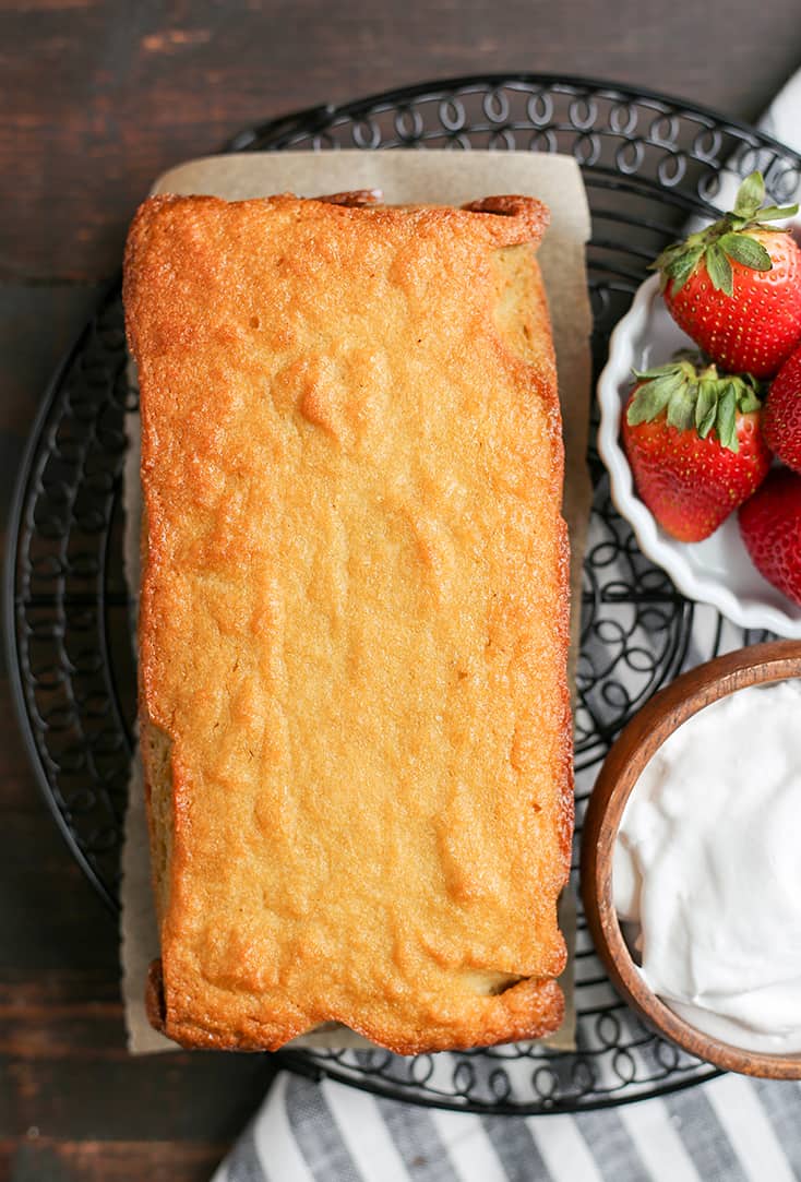 This Paleo Strawberry Shortcake Poundcake is easy to make and a great spring dessert. Tender cake covered in sweet strawberries topped with whipped topping. It's gluten free, dairy free, nut free and delicious!