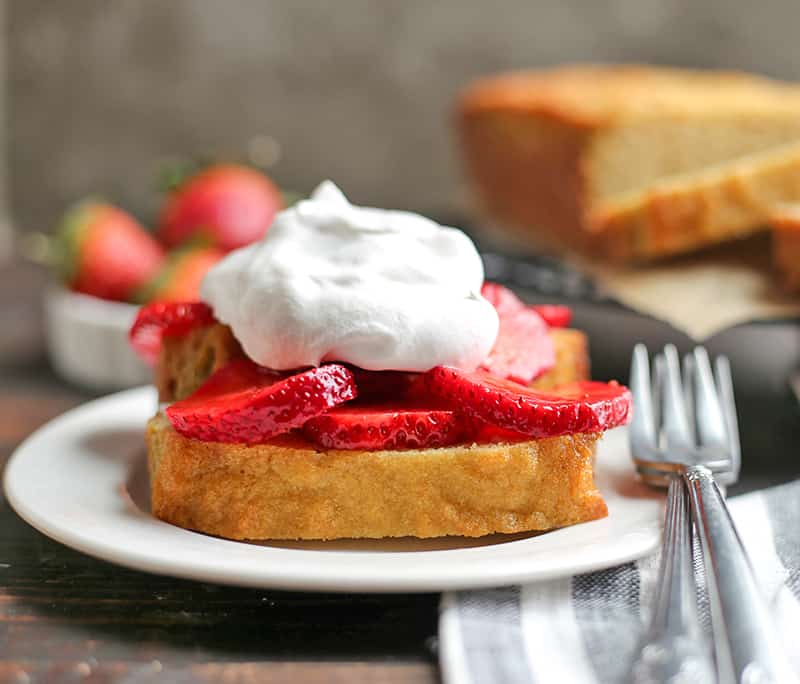 This Paleo Strawberry Shortcake Poundcake is easy to make and a great spring dessert. Tender cake covered in sweet strawberries topped with whipped topping. It's gluten free, dairy free, nut free and delicious!