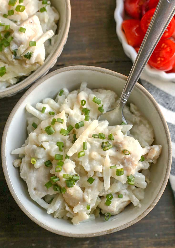 This Paleo Whole30 Chicken Alfredo Casserole is easy to make and pure comfort food. Tender chicken and potatoes covered in a creamy sauce. Gluten free, dairy free, and low FODMAP.