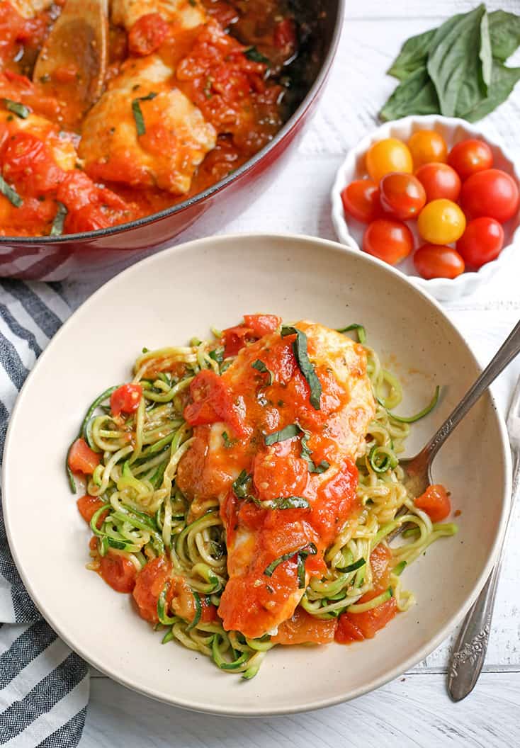 This Paleo Whole30 Garlic Tomato Basil Chicken is quick and so easy. A fresh tomato sauce and tender chicken that is ready in 20 minutes. Gluten free, dairy free, low carb, and low FODMAP.