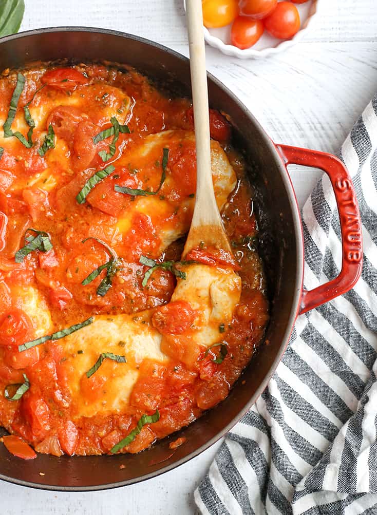 This Paleo Whole30 Garlic Tomato Basil Chicken is quick and so easy. A fresh tomato sauce and tender chicken that is ready in 20 minutes. Gluten free, dairy free, low carb, and low FODMAP.