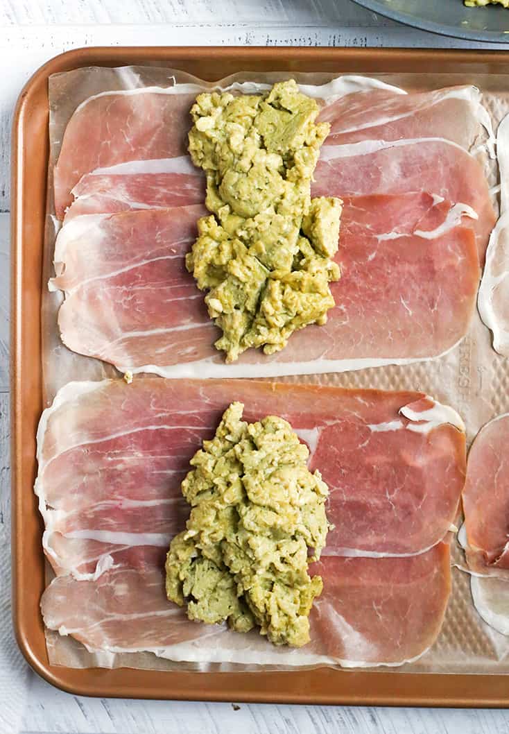 These Paleo Whole30 Pesto Prosciutto Egg Wraps are a fun, handheld breakfast. Tender cooked eggs wrapped in crispy proscuitto making a healthy burrito. They are gluten free, dairy free, low carb and low FODMAP.