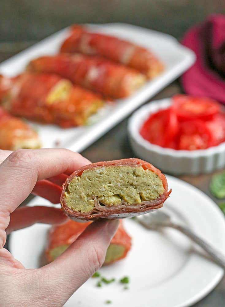 These Paleo Whole30 Pesto Prosciutto Egg Wraps are a fun, handheld breakfast. Tender cooked eggs wrapped in crispy proscuitto making a healthy burrito. They are gluten free, dairy free, low carb and low FODMAP.