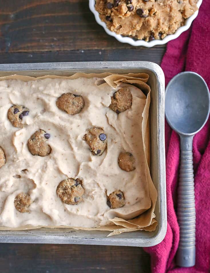 This Paleo Cookie Dough Ice Cream is rich, creamy, and so delicious. Vanilla dairy free ice cream with chunks of edible cookie dough that is vegan, nut free, egg free, gluten free, and naturally sweetened.