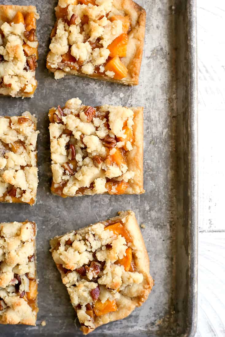 These Paleo Peach Pie Crumb Bars have all the flavor of the classic pie, but made was easier! They are vegan, gluten free, dairy free, egg free, and naturally sweetened.