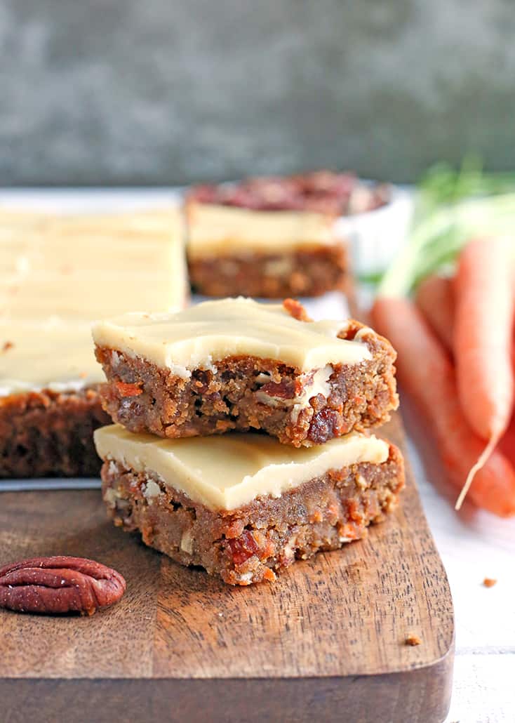 These Paleo Vegan Carrot Cake Bars are easy to make and so tasty. Moist, spiced just right, and topped with a delicious  frosting. Gluten free, dairy free, egg free, and naturally sweetened.