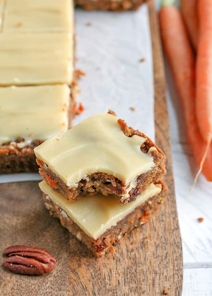 These Paleo Vegan Carrot Cake Bars are easy to make and so tasty. Moist, spiced just right, and topped with a delicious  frosting. Gluten free, dairy free, egg free, and naturally sweetened.