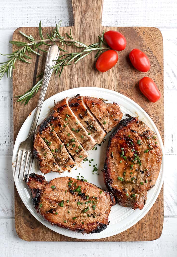 These Paleo Whole30 Dijon Rosemary Pork Chops are easy to make and so flavorful. Perfect for the grill, but still delicious cooked indoors. They're dairy free, low carb, low FODMAP and sugar free.
