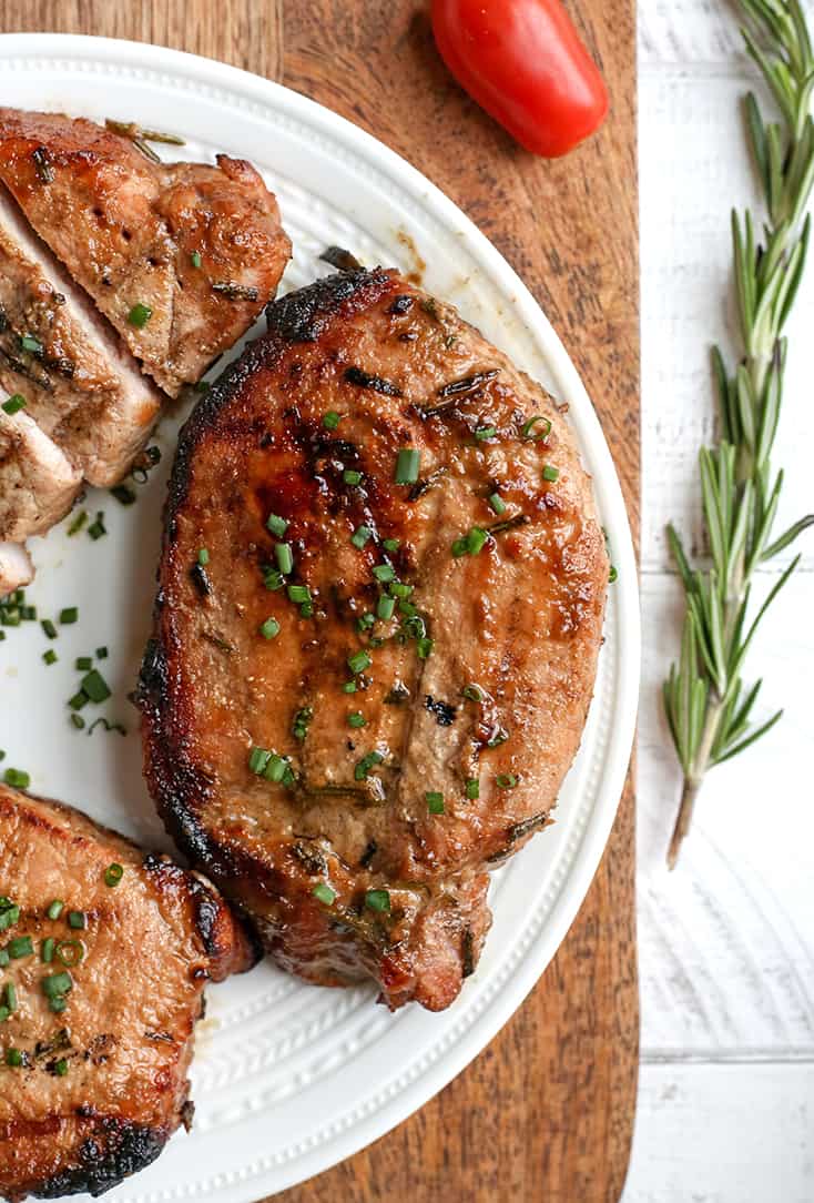 These Paleo Whole30 Dijon Rosemary Pork Chops are easy to make and so flavorful. Perfect for the grill, but still delicious cooked indoors. They're dairy free, low carb, low FODMAP and sugar free.