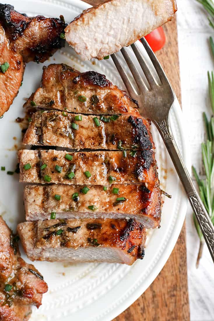 These Paleo Whole30 Dijon Rosemary Pork Chops are easy to make and so flavorful. Perfect for the grill, but still delicious cooked indoors. They're dairy free, low carb, low FODMAP and sugar free.