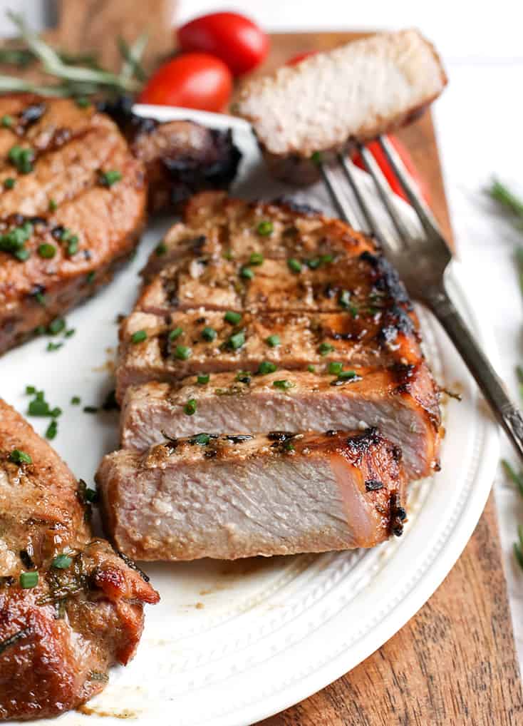 These Paleo Whole30 Dijon Rosemary Pork Chops are easy to make and so flavorful. Perfect for the grill, but still delicious cooked indoors. They're dairy free, low carb, low FODMAP and sugar free.