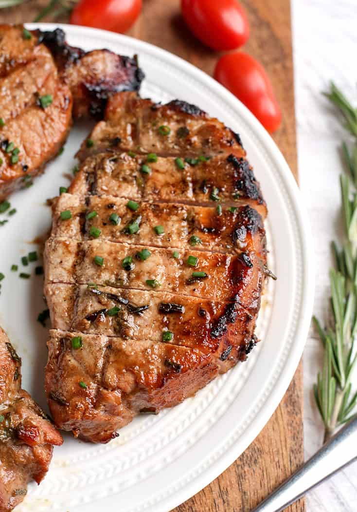 These Paleo Whole30 Dijon Rosemary Pork Chops are easy to make and so flavorful. Perfect for the grill, but still delicious cooked indoors. They're dairy free, low carb, low FODMAP and sugar free.