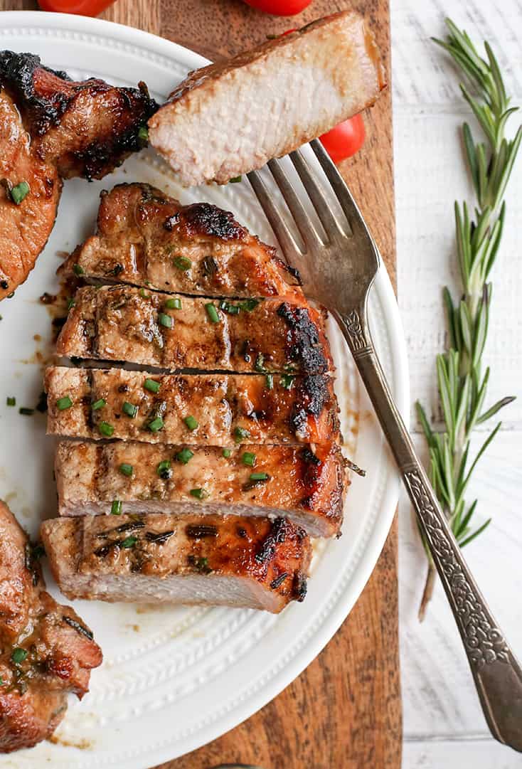 These Paleo Whole30 Dijon Rosemary Pork Chops are easy to make and so flavorful. Perfect for the grill, but still delicious cooked indoors. They're dairy free, low carb, low FODMAP and sugar free.