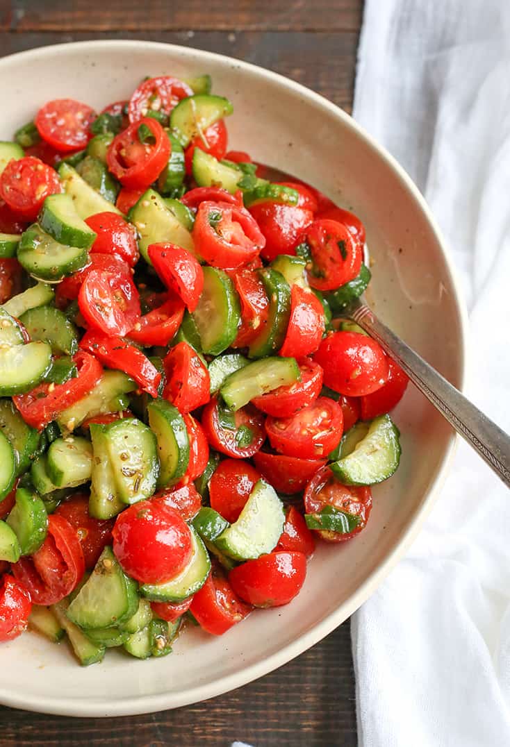 This Paleo Whole30 Tomato Cucumber Salad is quick to make and so delicious! A great, light and refreshing side dish. It's gluten free, dairy free, low carb and low FODMAP.