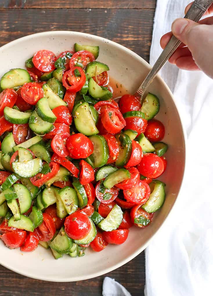 This Paleo Whole30 Tomato Cucumber Salad is quick to make and so delicious! A great, light and refreshing side dish. It's gluten free, dairy free, low carb and low FODMAP.
