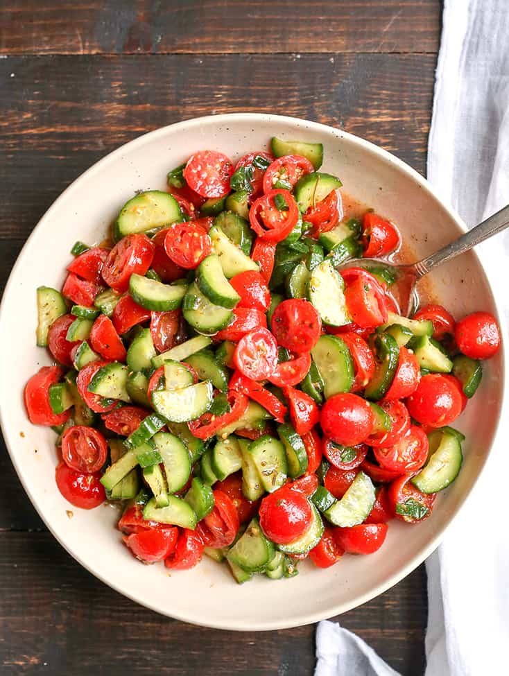 This Paleo Whole30 Tomato Cucumber Salad is quick to make and so delicious! A great, light and refreshing side dish. It's gluten free, dairy free, low carb and low FODMAP.