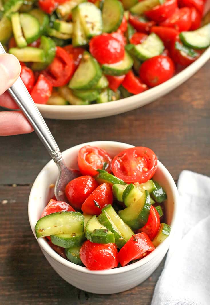 This Paleo Whole30 Tomato Cucumber Salad is quick to make and so delicious! A great, light and refreshing side dish. It's gluten free, dairy free, low carb and low FODMAP.