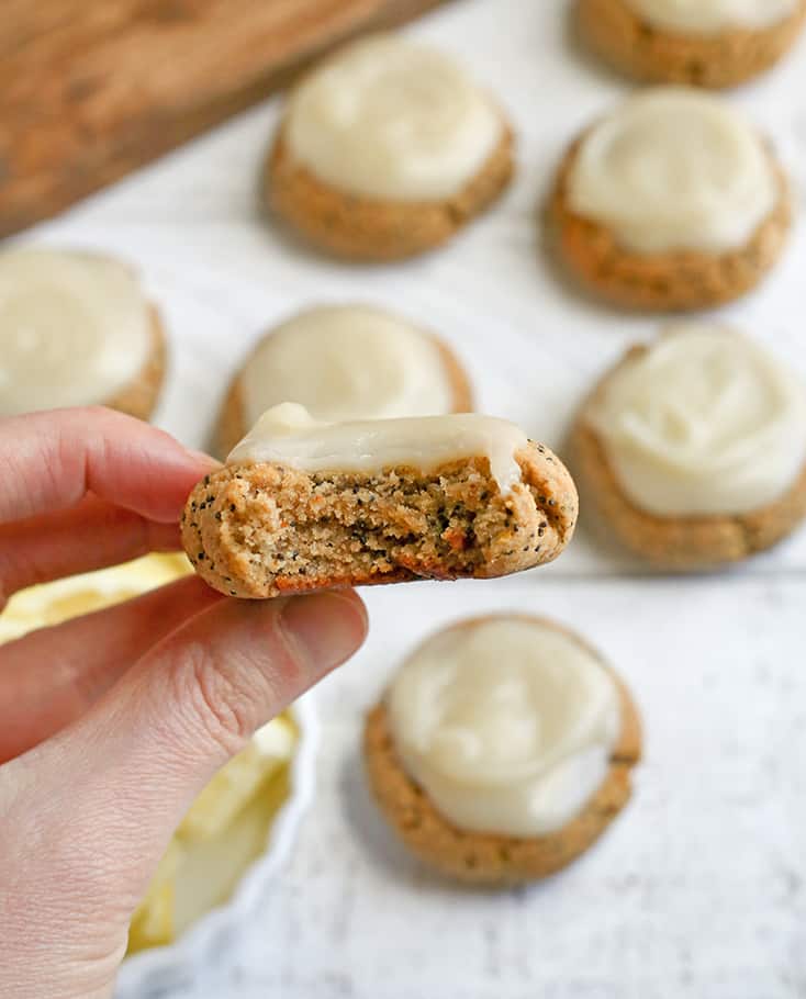 These Soft Paleo Lemon Poppy Seed Cookies are easy to make and so delicious! A tender cookie topped with a sweet and tangy glaze. Gluten free, dairy free, and naturally sweetened.