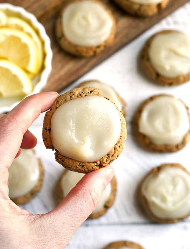 These Soft Paleo Lemon Poppy Seed Cookies are easy to make and so delicious! A tender cookie topped with a sweet and tangy glaze. Gluten free, dairy free, and naturally sweetened.