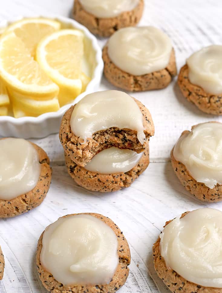 These Soft Paleo Lemon Poppy Seed Cookies are easy to make and so delicious! A tender cookie topped with a sweet and tangy glaze. Gluten free, dairy free, and naturally sweetened.