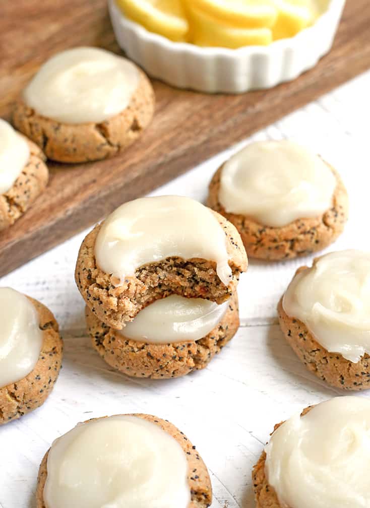 These Soft Paleo Lemon Poppy Seed Cookies are easy to make and so delicious! A tender cookie topped with a sweet and tangy glaze. Gluten free, dairy free, and naturally sweetened.