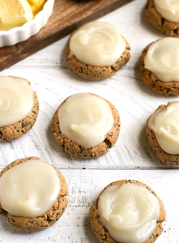 These Soft Paleo Lemon Poppy Seed Cookies are easy to make and so delicious! A tender cookie topped with a sweet and tangy glaze. Gluten free, dairy free, and naturally sweetened.