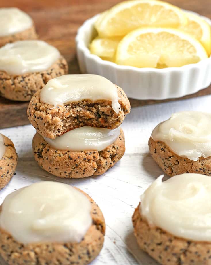 These Soft Paleo Lemon Poppy Seed Cookies are easy to make and so delicious! A tender cookie topped with a sweet and tangy glaze. Gluten free, dairy free, and naturally sweetened.