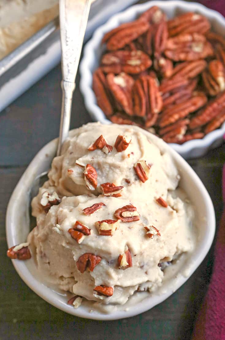 This Paleo Butter Pecan Ice Cream is rich, sweet and packed with buttery pecans. The perfect summer treat! Dairy free, gluten free, and naturally sweetened.