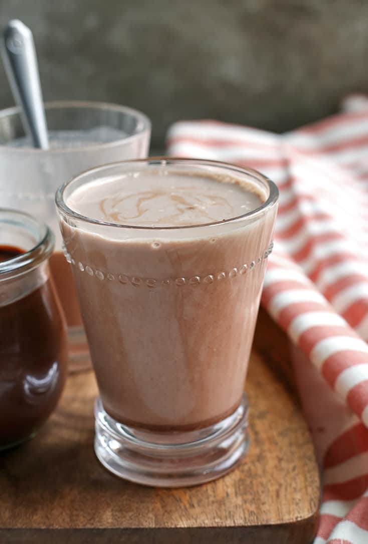 This Paleo Chocolate Milk Syrup is simple to make and so delicious. Mix with your favorite nut milk or coconut milk for a sweet treat. Dairy free, low FODMAP, vegan, and naturally sweetened.